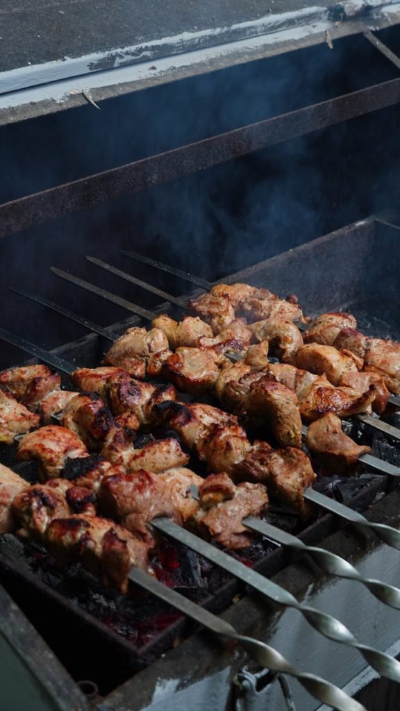 delicious-grilled-chicken-skewers-on-barbecue-32023378